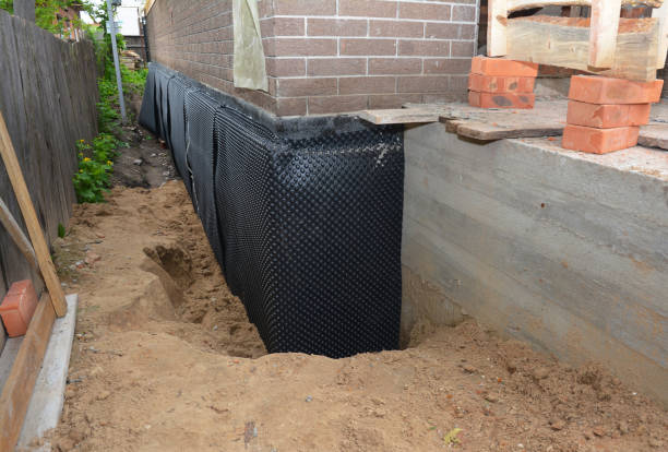 Happy homeowners after waterproofing job in Theresa